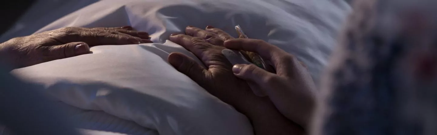 Person assisting dying hospice patient