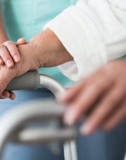 Close up of elderly person with walking zimmer