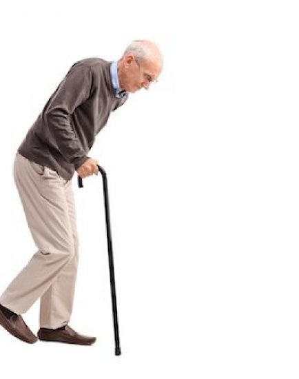 Studio shot of an exhausted old man walking with a cane isolated on white background