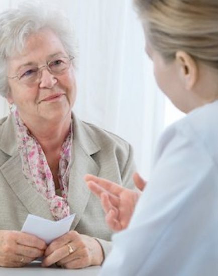 doctor explaining diagnosis to his female patient