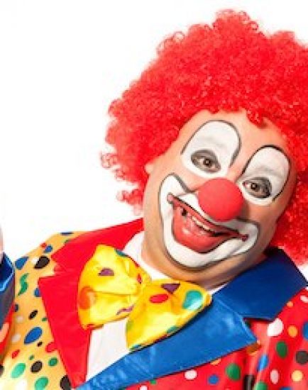 Portrait of a smiling clown isolated on white