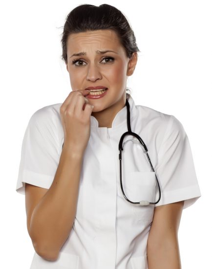 a young woman doctor with a mistake gesture