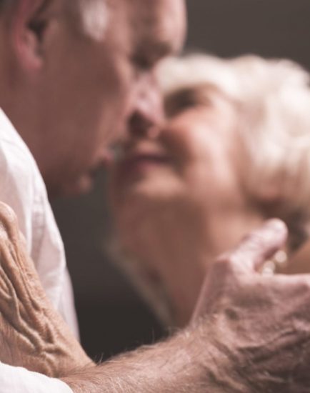 Shot of an elderly couple holding each other