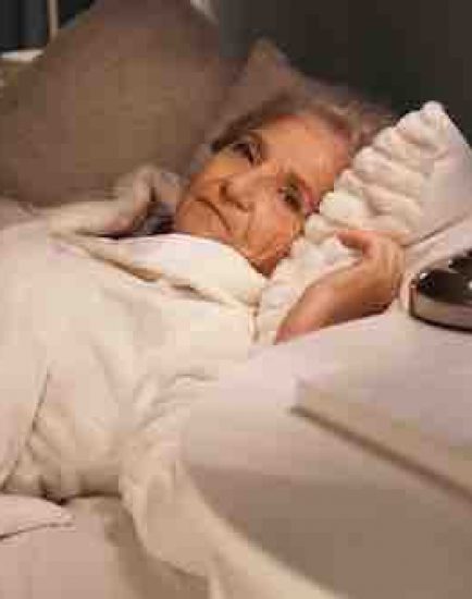 Senior woman suffering from insomnia at night